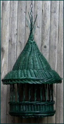 Handwoven birdfeeder from green colored reed by basket artist Tina Puckett