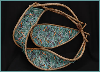 Fish Bowl, a whimsical wallhanging sculpture by master basket weaver Tina Puckett