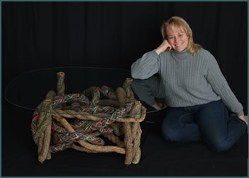 Master weaver Tina Puckett with her custom built, custom-woven end table Swirls of Pastel
