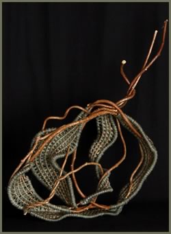 Whimsical is a free-standing woven sculpture by master weaver Tina Puckett of Winsted, CT